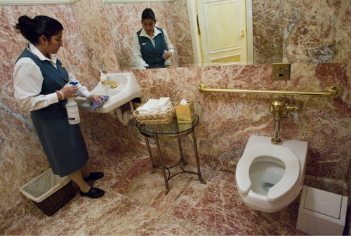 Jim Urquhart  |  The Salt Lake Tribune
Brass faucets and handrails, plush linen hand towels and golden tissue boxes and garbage cans are cleaned on an hourly basis by Grand America Hotel employees, such as Liza Rosas. The hotel's dedication to elegant hygiene has made it one of 10 national nominees for an 