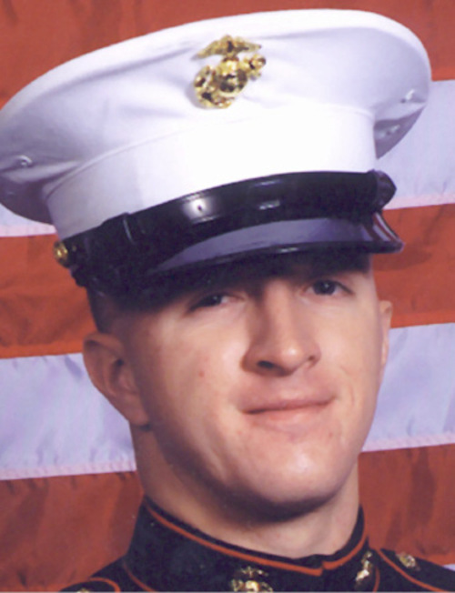 ** FILE ** This is a February 2003 photo of U.S. Marine Matthew Smith, 24, taken in West Valley City, Utah, who family members said was killed in Iraq on Wednesday, Jan. 26, 2005. Smith was one of 30 Marines and a sailor killed in a helicopter crash in a desert storm. (AP Photo/Kiddie Kandids, Tammy Grant)