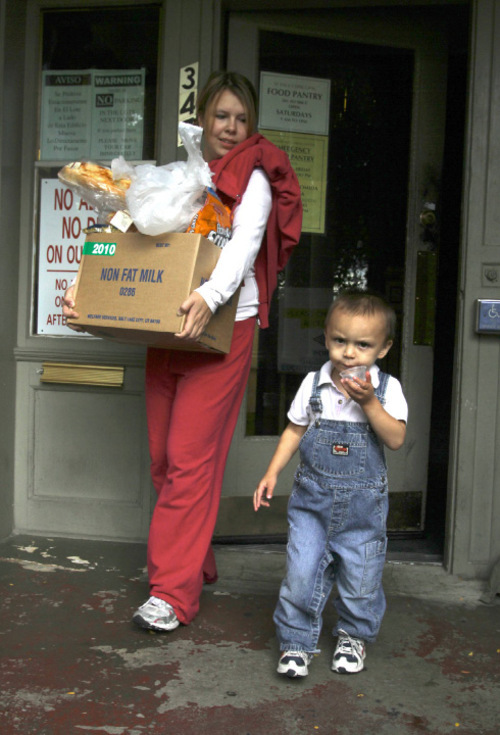 Rick Egan   |  The Salt Lake Tribune

 Danielle Martinez and her 2-year-old son Dareance Martinez leave the Crossroads Urban Center, with food and diapers, Monday, Oct. 4, 2010.