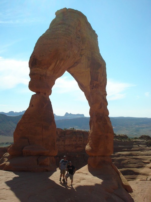Former University of Missouri-Columbia Mark Twain Residence Hall roommates Nate Carlisle (left) and Rob Covert stand in front of Delicate Arch in Arches National Park on Oct. 1, 2010. Photo by The Salt Lake Tribune.
