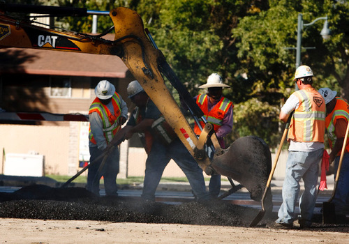 Leah Hogsten  |  The Salt Lake Tribune UTA contractors are laying the new FrontRunner South commuter-rail lines.