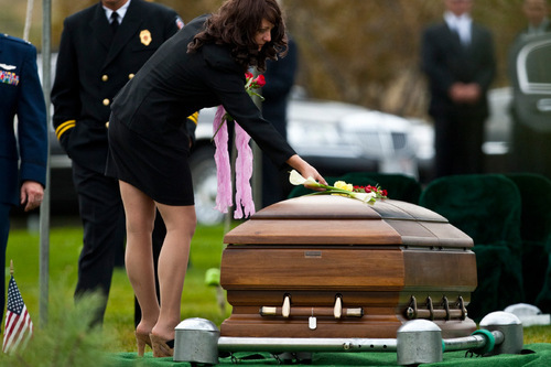 Chris Detrick  |  The Salt Lake Tribune &#xA;Tiffany Wagstaff lays flowers on her husband's casket during the burial of U.S. Army Blackhawk helicopter pilot Matthew G. Wagstaff at the Utah Veterans Memorial Park Tuesday October 5, 2010.  Wagstaff, a 10-year veteran of the Army's 101st Airborne Division, died in a Sept. 21 helicopter crash in Afghanistan. It was his second deployment to Afghanistan. He also had served in Iraq.