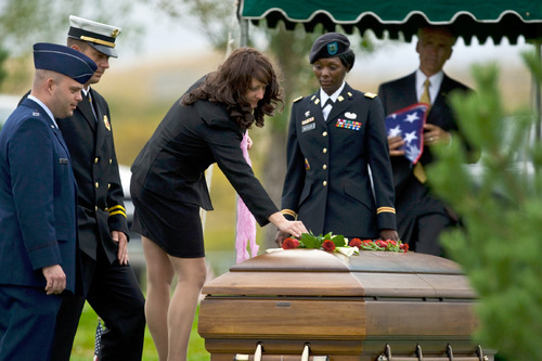 Chris Detrick  |  The Salt Lake Tribune &#xA;Tiffany Wagstaff lays flowers on her husband's casket during the burial of U.S. Army Blackhawk helicopter pilot Matthew G. Wagstaff at the Utah Veterans Memorial Park Tuesday October 5, 2010.  Wagstaff, a 10-year veteran of the Army's 101st Airborne Division, died in a Sept. 21 helicopter crash in Afghanistan. It was his second deployment to Afghanistan. He also had served in Iraq.