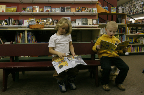 Rick Egan   |  The Salt Lake Tribune&#xA;&#xA;Holis Leitch, 5, and Brayden Porter, 5,  read books at The Sam Wellers Book store on Main Street. The store will soon relocate somewhere downtown. Wednesday, November 25, 2009