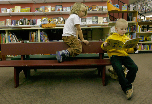 Rick Egan   |  The Salt Lake Tribune&#xA;&#xA;Holis Leitch, 5, and Brayden Porter, 5,  read books at The Sam Wellers Book store on Main Street. The store will soon relocate somewhere downtown. Wednesday, November 25, 2009