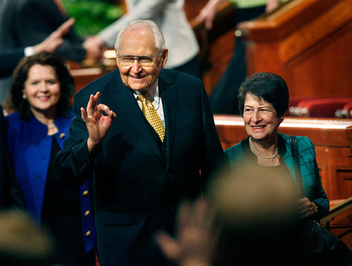 Scott Sommerdorf  l  The Salt Lake Tribune

Elder L. Tom Perry, of the Quorum of the Twelve Apostles of The Church of Jesus Christ of Latter-day Saints, with his wife, Barbara, at his side, gestures to audience members while leaving the conference center after the afternoon session of LDS General Conference, on Sunday.