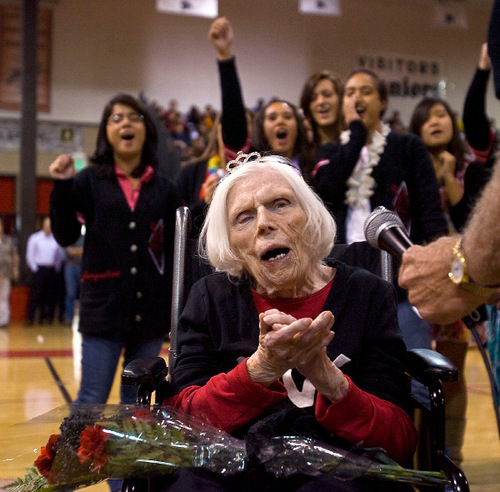 Al Hartmann  |  The Salt Lake Tribune
104-year-old Lillian Draper, who is believed to be West High School's oldest living alumni, leads students in an old fight song from her days at the school during a homecoming assembly Thursday on Oct. 7.