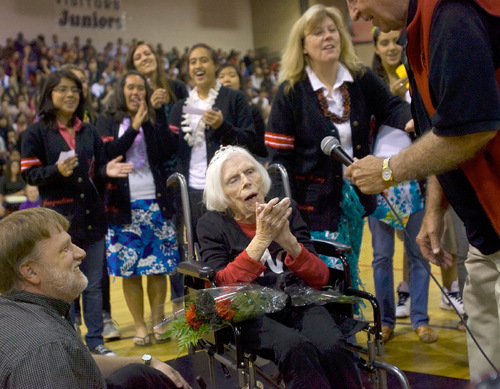 Al Hartmann  |  Salt Lake Tribune
104-year-old Lillian Draper, who is believed to be West High School's  oldest living alumnus leads students in and old fight song from her days at the school during a homecoming assembly Thursday October 7th.  
