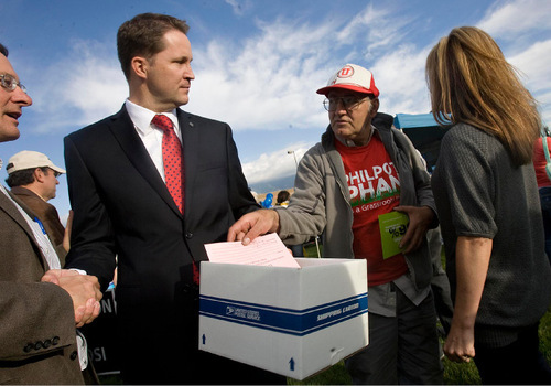 Djamila Grossman  |  The Salt Lake Tribune&#xA;&#xA;Republican Morgan Philpot looks at George Zinn who turns in his symbolic 