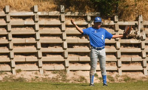 Leah Hogsten  |  The Salt Lake Tribune 
2 -- Tastan Sperling reacts to the coach about a hit out of the ballpark. The Salt Lake Lutheran baseball team during their last game of the season Friday, October 1, 2010, in SLC at Lindsay Gardens. The Salt Lake Lutheran baseball team, a collection of rookies that make up a varsity squad, has struggled in another lousy season. In their opener against Tabiona, the Lynx lost 39-2. But this is a team of kids who play baseball merely so there could be a baseball team at Salt Lake Lutheran.