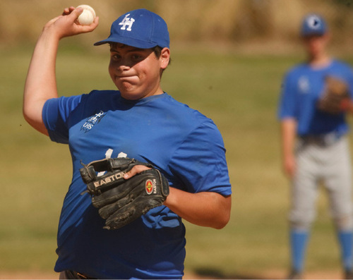 Leah Hogsten  |  The Salt Lake Tribune 
11 -- Andrew Cataldo throws a pitch. The Salt Lake Lutheran baseball team during their last game of the season Friday, October 1, 2010, in SLC at Lindsay Gardens. The Salt Lake Lutheran baseball team, a collection of rookies that make up a varsity squad, has struggled in another lousy season. In their opener against Tabiona, the Lynx lost 39-2. But this is a team of kids who play baseball merely so there could be a baseball team at Salt Lake Lutheran.