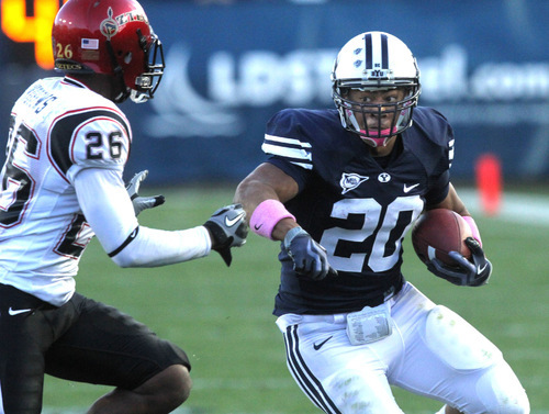 Rick Egan   |  The Salt Lake Tribune&#xA;&#xA;Joshua Quezada  runs the ball for the Cougars, as Marcus Andrews (26) defends for the Aztecs in football action, BYU vs. San Diego State, at Lavell Edwards Stadium in Provo,  Saturday, October 9, 2010