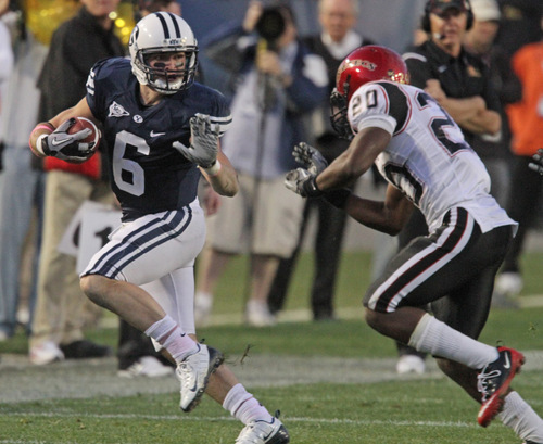 Rick Egan   |  The Salt Lake Tribune&#xA;&#xA;McKay Jacobsen runs for the cougars, as Nate Berhe defends for the Aztecs, in football action,  BYU vs. San Diego State, game at Lavell Edwards Stadium in Provo,  Saturday, October 9, 2010