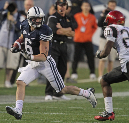 Rick Egan   |  The Salt Lake Tribune&#xA;&#xA;McKay Jacobsen runs for the cougars, as Nate Berhe defends for the Aztecs, in football action,  BYU vs. San Diego State, game at Lavell Edwards Stadium in Provo,  Saturday, October 9, 2010