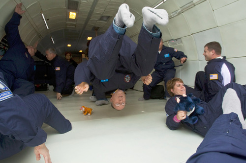 Chris Detrick  |  The Salt Lake Tribune &#xA;John Petersen, center, a teacher at South Cache 8-9 Center in Hyrum, floats around weightless inside of a modified Boeing 727 during the Northrop Grumman Foundation Weightless Flights of Discovery zero-gravity flight Monday October 11, 2010.  While on the Boeing 727, parabolic arcs are performed to create a weightless environment inside of the airplane.  Each weightless session lasts approximately 25 seconds.