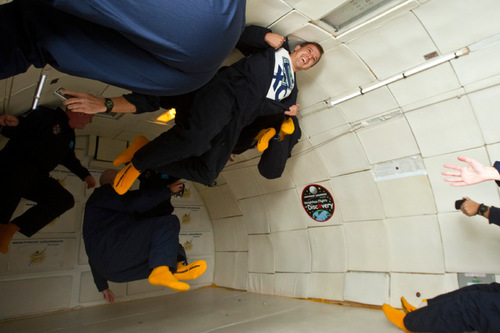 Chris Detrick  |  The Salt Lake Tribune &#xA;Justin Frost shows off his Syracuse Cross Country shirt while floating around weightless inside of a modified Boeing 727 during the Northrop Grumman Foundation Weightless Flights of Discovery zero-gravity flight Monday October 11, 2010.  While on the Boeing 727, parabolic arcs are performed to create a weightless environment inside of the airplane.  Each weightless session lasts approximately 25 seconds.