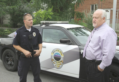 Rick Egan   |  The Salt Lake Tribune
Midvale police officer Aaron Upwall, left, talks with Midvale police Chief Tony Mason, at the Midvale Police Department. Murray and Midvale both had increases in crime in 2009.