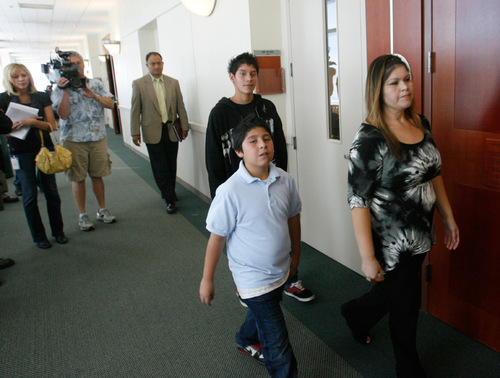 Rick Egan   |  The Salt Lake Tribune
Rina Perez and her children, Thomas, 14, and Raul, 9, leave the Matheson courthouse, Friday, October 15, 2010, after the sentencing of Luka Kang. Perez, the mother of one of the children hit by Kang, was unhappy with his sentence of five years of probation.