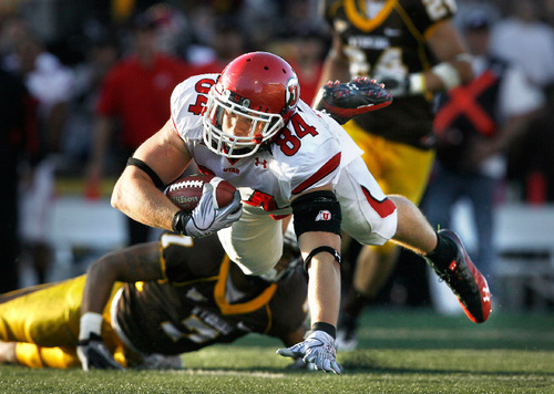 Scott Sommerdorf  l  The Salt Lake Tribune&#xA;Utah Utes tight end Brad Clifford (84) dives after making a first half catch that led to a Utah FG. The Utah Utes held a 23-0 halftime lead at Wyoming, Saturday 10/16/2010.