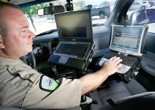 Scott Sommerdorf  l  The Salt Lake Tribune

Weber County sheriff's Deputy Wade Follum works a computer program that can process several hundred license plate numbers in an hour.