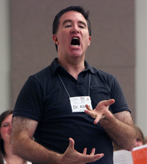 Steve Griffin  |  The Salt Lake Tribune&#xA;&#xA;  Brady Allred shows the high school students enrolled in his choral summer  camp how to make a different sound by raising our top lip during a mass rehearsal at Gardener Hall on the campus of the University of Utah in Salt Lake City on Thursday, August 12, 2010.