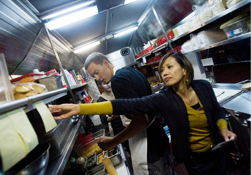 Djamila Grossman  |  The Salt Lake Tribune&#xA;&#xA;SuAn Chow works in her Chow Truck, together with Casey Fenger and Hannah Roberts, in front of Ken Sanders Rare Books store in Salt Lake City, Friday, Oct. 15, 2010.  Chow has successfully pushed the city into writing new rules for food trucks.