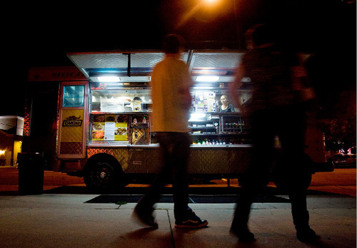 Djamila Grossman  |  The Salt Lake Tribune

Customers stand in front of SuAn Chow's Chow Truck, which is parked at Ken Sanders Rare Books store in Salt Lake City, Friday, Oct. 15, 2010.  Chow has successfully pushed the city into writing new rules for food trucks.