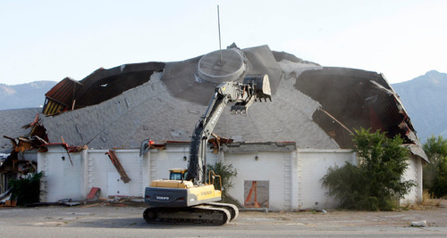 Steve Griffin  |  The Salt Lake Tribune

 The southern part of the Cinedome 70 in Riverdale collapses in on itself as Sahara Construction crews demolish the iconic theater Monday, Oct. 18, 2010.