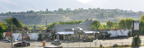 Steve Griffin  |  The Salt Lake Tribune&#xA;&#xA;  Sahara Construction crews demolish the iconic Cinedome 70 theatre Monday, October 18, 2010. The twin-domed theater  was built, owned and operated by two families - Darrell Tullis and Roy Hansen. It first opened its doors in 1970, providing state of the art sound, two 80-foot curved screens, domed ceilings and 800 seats on each side. It operated until 2001, then went bust because of the megaplexes cropping up everywhere.  The Larry H. Miller Group recently finalized its purchase of the property and will build a car lot there to open next June.&#xA;