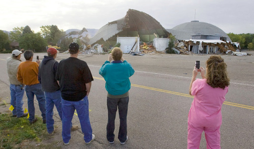 Steve Griffin  |  The Salt Lake Tribune&#xA;&#xA; With cameras in hand onlookers record the demolition of the Cinedome 70 in Riverdale, by Sahara Construction out of Bountiful  Monday, October 18, 2010. The twin-domed theater  was built, owned and operated by two families - Darrell Tullis and Roy Hansen. It first opened its doors in 1970, providing state of the art sound, two 80-foot curved screens, domed ceilings and 800 seats on each side. It operated until 2001, then went bust because of the megaplexes cropping up everywhere.  The Larry H. Miller Group recently finalized its purchase of the property and will build a car lot there to open next June.&#xA;