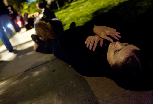 Djamila Grossman  |  The Salt Lake Tribune&#xA;&#xA;Eileen McCabe of Taylorsville lays on the ground with hundreds of others at Temple Square in Salt Lake City, Thursday, Oct. 7, 2010. Supporters of the lesbian, gay, bisexual and transgender (LGBT) community protested recent remarks by LDS apostle Boyd K. Packer that same-sex attraction is 