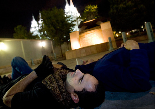 Djamila Grossman  |  The Salt Lake Tribune
David Olson of Provo and John Gonzalez of Orem join thousands of others in laying down on the pavement, forming a chain around Temple Square in Salt Lake City, Thursday, Oct. 7, 2010. Supporters of the lesbian, gay, bisexual and transgender (LGBT) community protested recent remarks by LDS apostle Boyd K. Packer that same-sex attraction is 