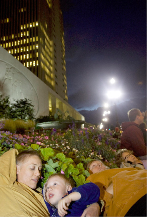 Djamila Grossman  |  The Salt Lake Tribune&#xA;&#xA;Annette Ephroni and her son Jonah Ephroni, 3, lay down with hundreds of others near the LDS Church office building in Salt Lake City, Thursday, Oct. 7, 2010. Supporters of the lesbian, gay, bisexual and transgender (LGBT) community protested recent remarks by LDS apostle Boyd K. Packer that same-sex attraction is 