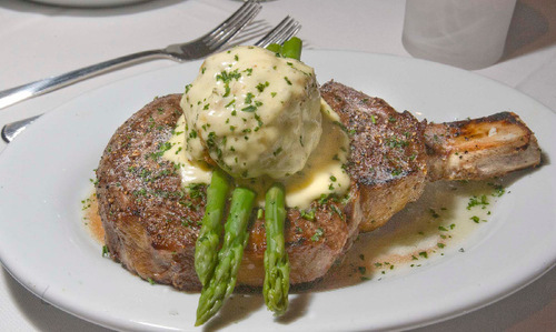 Paul Fraughton  |  The Salt Lake Tribune    A cowboy ribeye served Oscar-style with asparagus and  crab with Bearnaise sauce at Ruth's Chris in Salt Lake City.