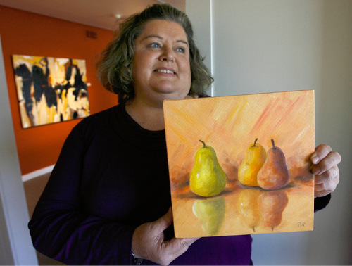 Steve Griffin  |  The Salt Lake Tribune&#xA;&#xA;Julie Hardle holds her oil on canvas painting titled 