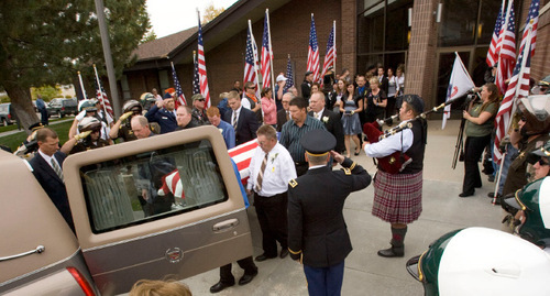 Steve Griffin  |  The Salt Lake Tribune&#xA;&#xA;Patriot Guard Riders hold flags as family and friends follow the casket of Jordan Byrd out of the Tooele South Stake Center during funeral services for Byrd who was killed in Afghanistan last week. Byrd was latter buried in the Grantsville City Cemetery Friday, October 22, 2010.