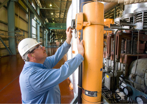 Al Hartmann  |  The Salt Lake Tribune&#xA;Electrician Brett West, 40, of Ferron, checks gauges in the generator room at the Hunter 2 power plant in Castle Dale. Generating electricity from coal mined locally has helped the economies of Emery and Carbon counties to weather the recession better than most areas of Utah and the country.