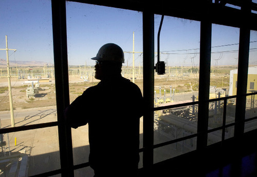 Al Hartmann  |  The Salt Lake Tribune&#xA;Standing at the bottom of a multi-story bay window in the Hunter 2 power plant in Castle Dale, electrician Ryan Jensen looks out at the 