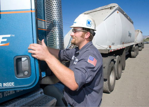 Al Hartmann  |  Salt Lake Tribune&#xA;Savage truck driver Gregg Burton climbs into the cab of his truck for a shift of driving coal from a mine to a train-loading facility near Price. Truck driving jobs in the coal industry of Carbon and Emery counties pay well and are stable. Electrical generation and its support services have helped Carbon and Emery counties to stay relatively healthy through the recession.