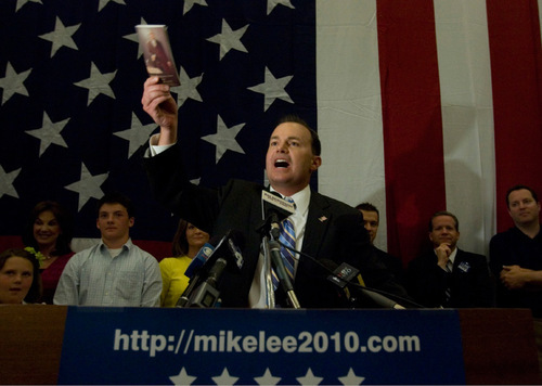 JIM URQUHART  |  The Salt Lake Tribune
Mike Lee holds up a copy of the Constitution on election night. Lee says he will not attempt to broaden his message after his Republican primary victory. He says his campaign message resonates with Utahns.