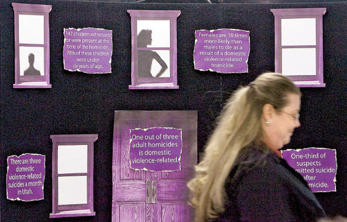 Steve Griffin  |  The Salt Lake Tribune

Nicole Williams, a domestic violence survivor, walks past a fact board, after speaking to the media about her domestic violence experiences during press conference at the Utah Health Department in Salt Lake City Tuesday, October 26, 2010. A new report by the Utah Health Department is the first in the nation to show the relationship between domestic violence and suicide.