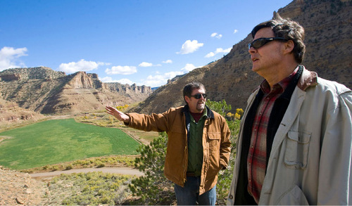 Al Hartmann  |  The Salt Lake Tribune  
Jerry Spangler, left, of the Colorado Plateau Archaelogical Alliance, and Jim Felton, communication manager for Bill Barrett Corp., take in the view above Nine Mile Canyon.    Just above the road are hundreds of examples of rock art.