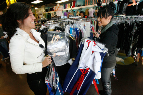 Francisco Kjolseth  |  The Salt Lake Tribune
Tiffanie Perotti, left, and Stephanie Sims have fun picking out costumes after waiting until the last minute during a visit to Pib's Exchange in Sugar House Wednesday. Most popular this year were Jesus and nun costumes along with celebrity costumes like Lady Gaga, Snooki and Katy Perry.