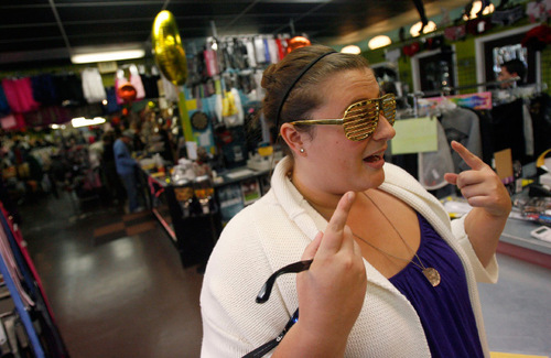 Francisco Kjolseth  |  The Salt Lake Tribune
Adrianna Pachelli discusses the rhinestones she needs for her glasses to complete her Snooki outfit during a last-minute stop at Pib's Exchange in Sugar House. Celebrities are always popular along with the usual witch, vampire and pirate costumes.