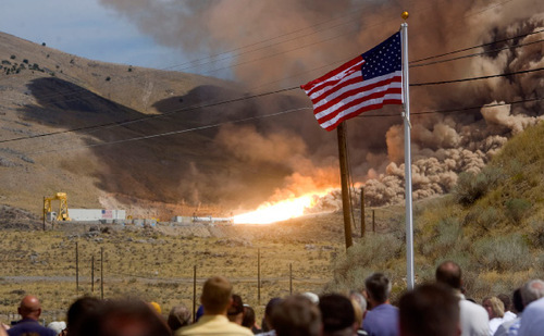 Al Hartmann  |  The Salt Lake Tribune ATK employees and guests of ATK and NASA watch from about about a mile away as ATK conducts a full-scale motor test for the Ares I solid rocket.  It went off without a hitch at 1 pm Thursday.