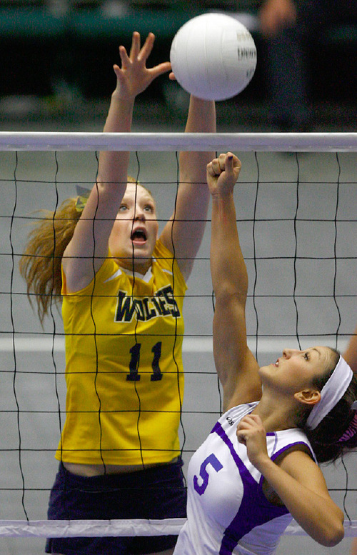 Djamila Grossman  |  The Salt Lake Tribune&#xA;&#xA;Enterprise High School's Anden Lyman, 11, blocks the ball hit by San Juan High School's Simone Shumway, 5, in the 2A championship game at Utah Valley University in Orem, Saturday, October 30, 2010. San Juan won the game.