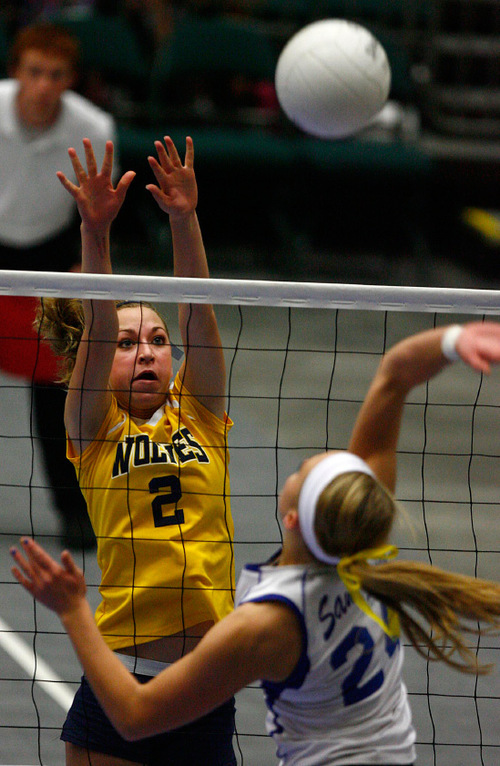 Djamila Grossman  |  The Salt Lake Tribune&#xA;&#xA;Enterprise High School's Summer Terry, 2, blocks the ball hit by San Juan High School's Erika Grover, 24, in the 2A championship game at Utah Valley University in Orem, Saturday, October 30, 2010. San Juan won the game.