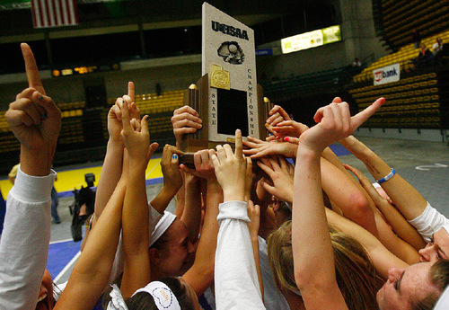 Djamila Grossman  |  The Salt Lake Tribune&#xA;&#xA;The San Juan High School volleyball team celebrates, holding up their trophy, after winning against Enterprise High School in the 2A championship game at Utah Valley University in Orem, Saturday, October 30, 2010.