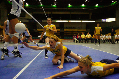 Djamila Grossman  |  The Salt Lake Tribune&#xA;&#xA;Enterprise High School's Anden Lyman, 11, and Tressa Lyman, 14, fall as they try to reach the ball - but miss - in the 2A championship game against San Juan High School at Utah Valley University in Orem, Saturday, October 30, 2010.