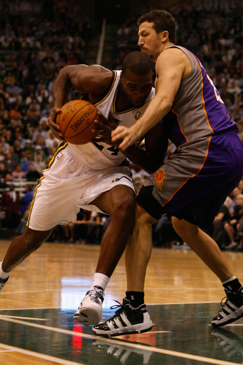Chris Detrick  |  The Salt Lake Tribune &#xA;Utah Jazz power forward Paul Millsap #24 is guarded by Phoenix Suns center Robin Lopez #15 during the first half of the game Thursday October 28, 2010.  Phoenix is winning the game 58-42.